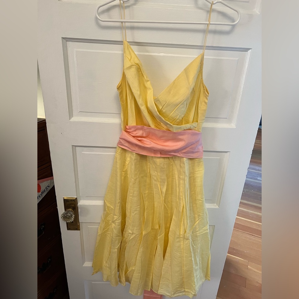 Yellow dress with pink sash